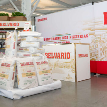 A company showcasing their product at the gold Pizza Competition