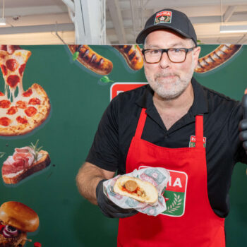 An employee of Roma at the Gold pizza Competition