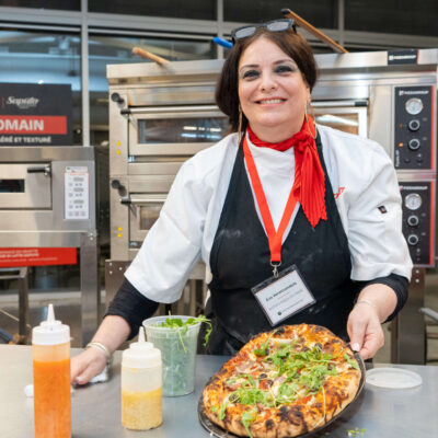 A woman competing int he Gold Pizza competition